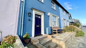 A blue house with a dark blue door, white shutters, and a bench outside. - 11 Crabbe Street, Aldeburgh (Aldeburgh)