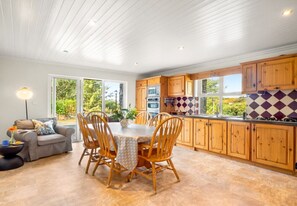 Enjoy meals in the kitchen with a central island, dining area, and living space.