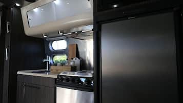 Airstream 23' International RBT | Living area | 15-inch flat-screen TV with digital channels, TV, DVD player
