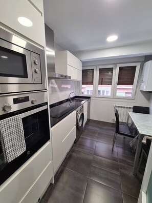 Coffee/tea maker, fridge, microwave, oven