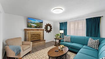 Smart TV, fireplace, table football, books