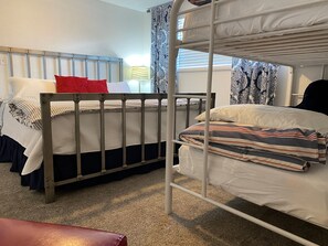 Bunk room with a bunk and an extra bed