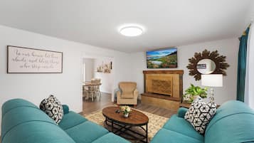 Smart TV, fireplace, table football, books