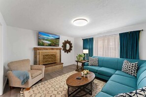 Smart TV, fireplace, table football, books