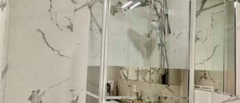 Shower, hair dryer, towels, soap