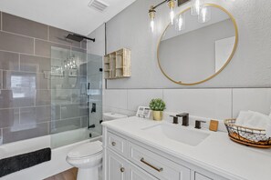 Combined shower/bathtub, hair dryer, towels, soap