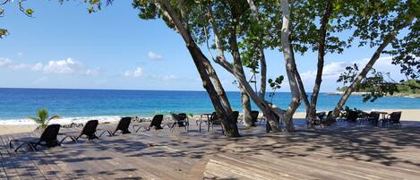 On the beach, sun-loungers, beach towels