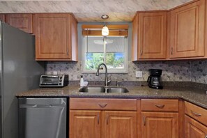 Fridge, stovetop, electric kettle, toaster