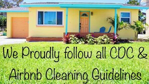 A single-story house with a yellow facade, a blue trim, and a front door. - Cowboy Pool / Mini Golf / Walk 2 Beach & Ocean Center! Pets OK (Daytona Beach)