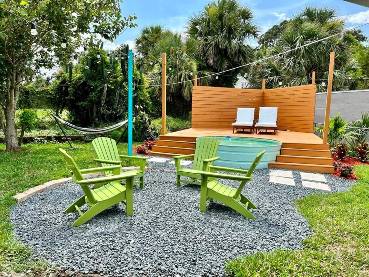 Backyard oasis with putting green, cowboy pool, covered porch, hammock and outdoor furniture!