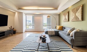 Superior Apartment | Living area | 32-inch LED TV with cable channels, TV