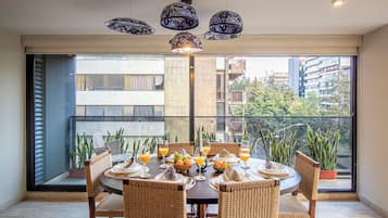 Premium Apartment | Living area | 42-inch Smart TV with cable channels
