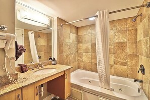 Shower, hair dryer, towels, shampoo