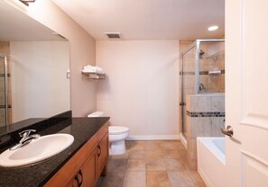 A modern bathroom with a sink, toilet, and glass-enclosed shower. - Ski Condo with Mountain and Resort View - Fraser Crossing/Founders Pointe Select-Rated 4457 (Winter Park)