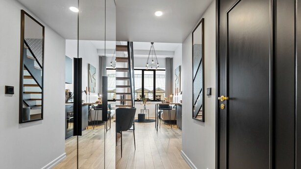 A modern interior with a staircase, a dining area, and a kitchen. - Bob W Tartu Old Town (Tartu)