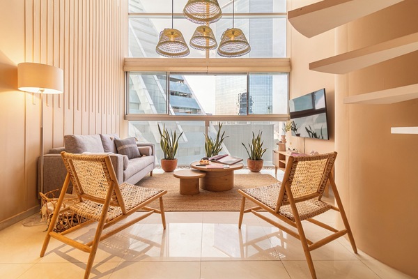 Exclusive Apartment | Living area | 50-inch LED TV with cable channels, TV, heated floors