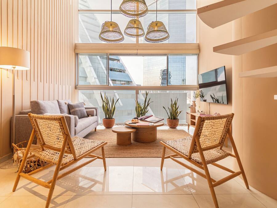 Exclusive Apartment | Living area | 50-inch LED TV with cable channels, TV, heated floors