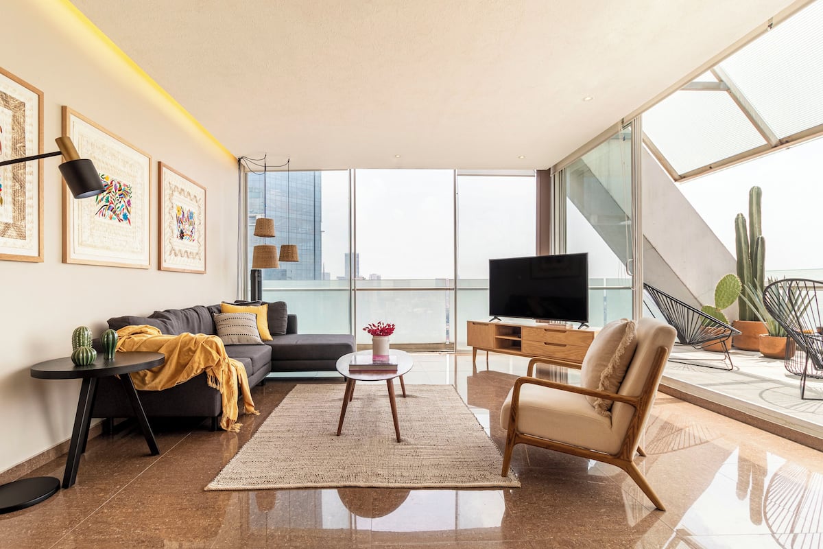 Deluxe Apartment, 1 Bedroom | Living area | 50-inch LED TV with cable channels, TV
