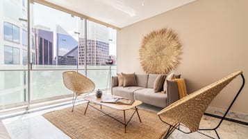 Comfort Apartment | Living area | 50-inch LED TV with cable channels, TV