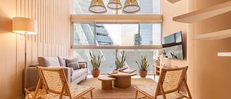 Exclusive Apartment | Living area | 50-inch LED TV with cable channels, TV