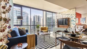 Comfort Loft | Living area | 50-inch LED TV with cable channels, TV