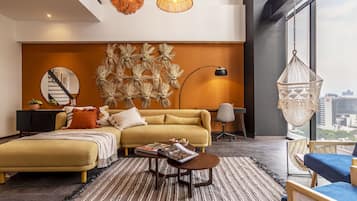 Deluxe Apartment | Living area | 50-inch LED TV with cable channels, TV, heated floors
