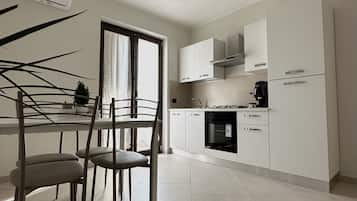 Fridge, oven, coffee/tea maker, cookware/dishes/utensils