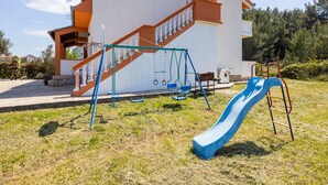 Children’s area - Apartments Torina - One Bedroom Apartment with Balcony and Sea View (Pasman)