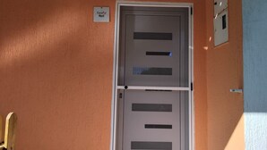 A door with a sign above it reading 'Local Host.'