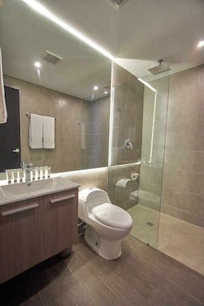 Shower, rainfall showerhead, hair dryer, towels
