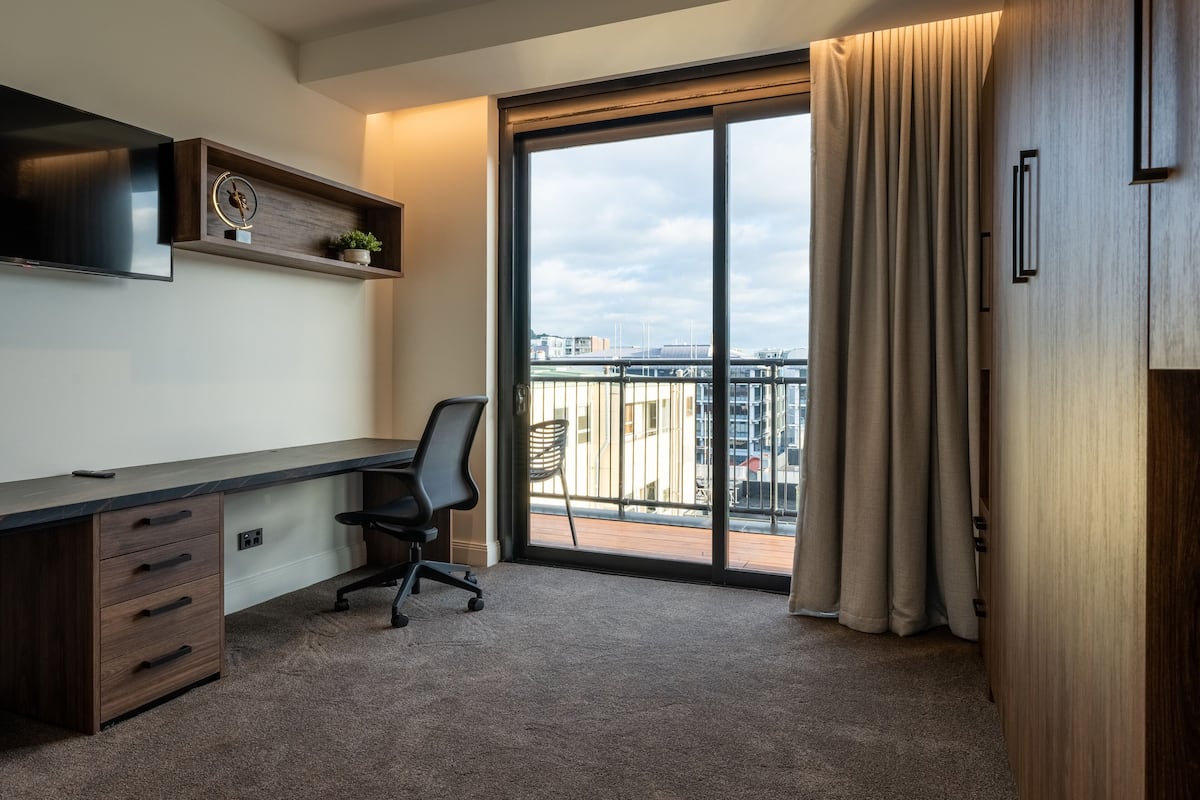 luxury penthouse, city view (4 king beds) | desk, laptop workspace, blackout curtains, soundproofing