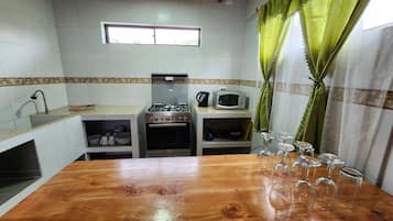 Family Cottage, 4 Bedrooms | Private kitchen | Full-sized fridge, stovetop, cookware/dishes/utensils