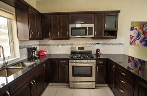 Fridge, cookware/dishes/utensils, dining tables