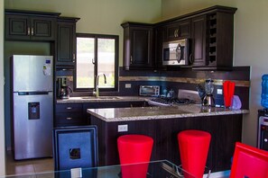 Fridge, cookware/dishes/utensils, dining tables