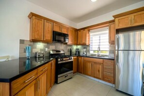 Fridge, cookware/dishes/utensils, dining tables