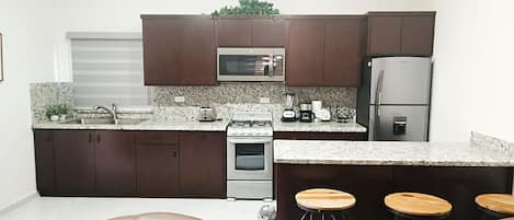 Apartment | Private kitchen | Full-size fridge, cookware/dishes/utensils