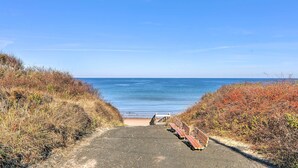 A pathway leading to a beach with benches and a clear view of the ocean. - Steps to Dennis Village! 'The Blue Scallop' Home (Dennis)