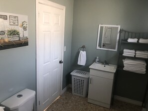 Combined shower/bathtub, hair dryer, towels, soap