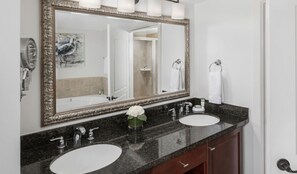 Bathtub, hair dryer, towels, soap