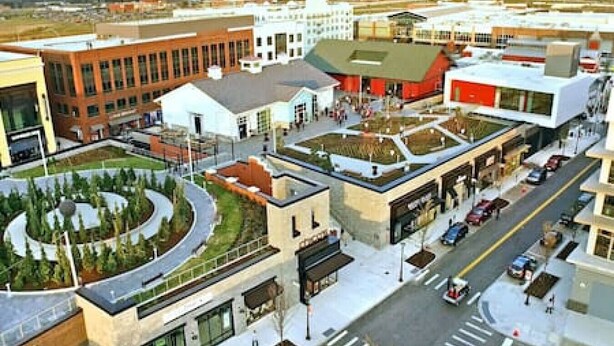 A modern urban area with a mix of commercial and residential buildings, a central plaza with greenery, and a clear road layout. - 17 S First - Unit 6 · 17 s first street unit 6 (Trenton)