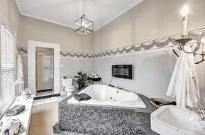 Bathtub, jetted bath, hair dryer, towels