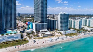 A coastal cityscape with high-rise buildings, a beach, and a marina. - Amazing apartment Lyfe Resort-& Residences- Ocean view! (Hollywood)
