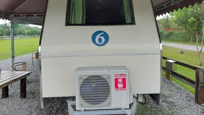 A caravan with a covered sleeping area, a number 6 sign, and an air conditioning unit. - caravan trailer (New Taipei City)