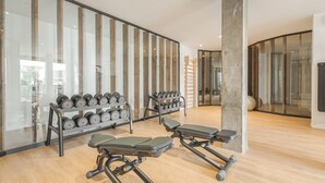 A gym with exercise equipment, including dumbbells and a bench. - Jardines - Tabor 3.3 PENTHOUSE WITH JACUZZI & POOL VIEW 2B (Arona)