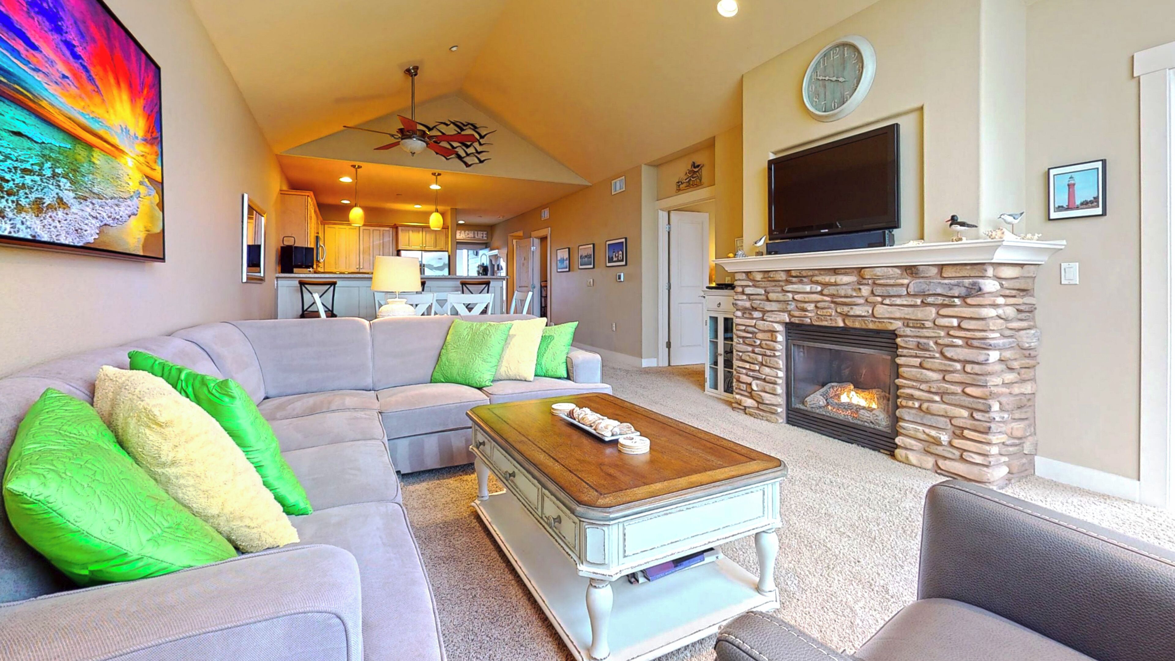 Taulutelevisio, takka, DVD-soitin, kirjoja