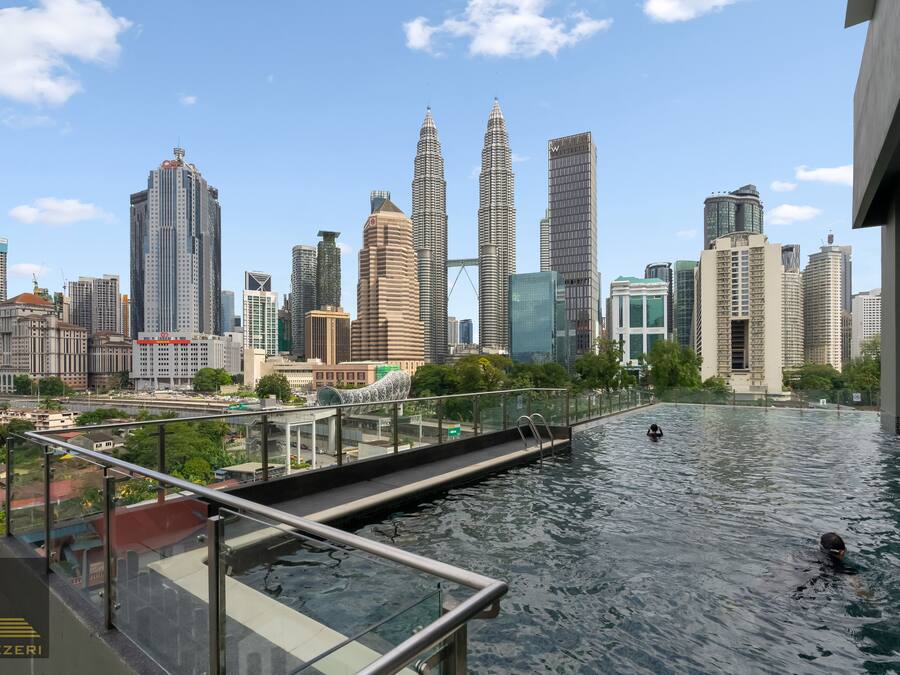 A rooftop pool with a city skyline in the background.