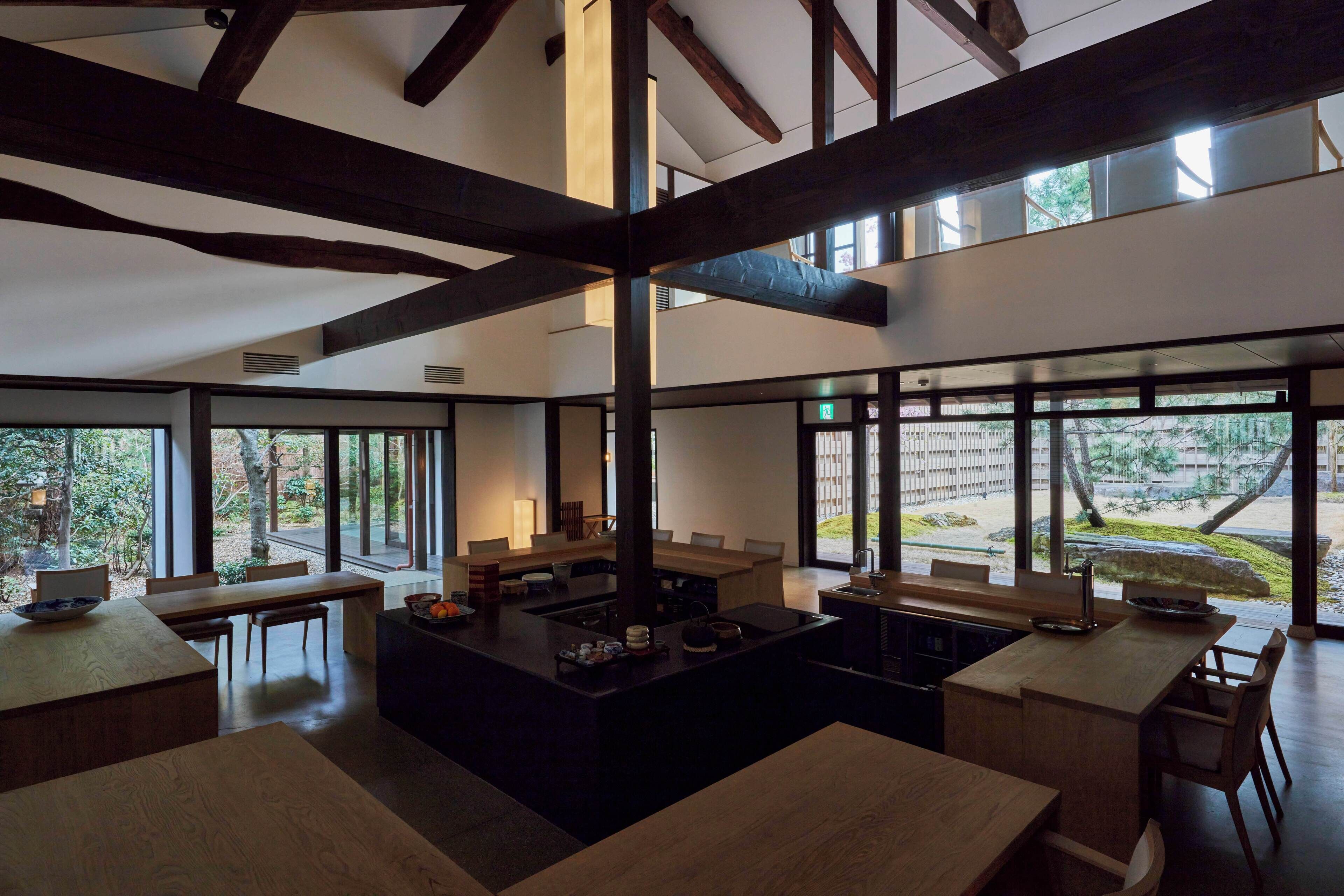 A spacious dining area with high ceilings and large windows.