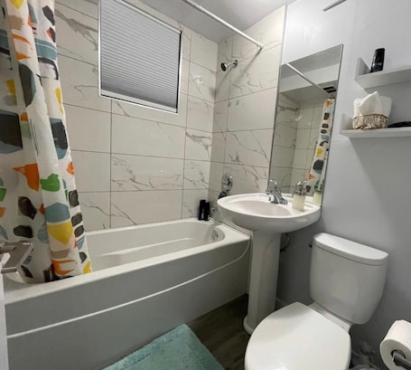 Combined shower/bathtub, hair dryer, towels, soap. Main Central Avenue Basement Suite