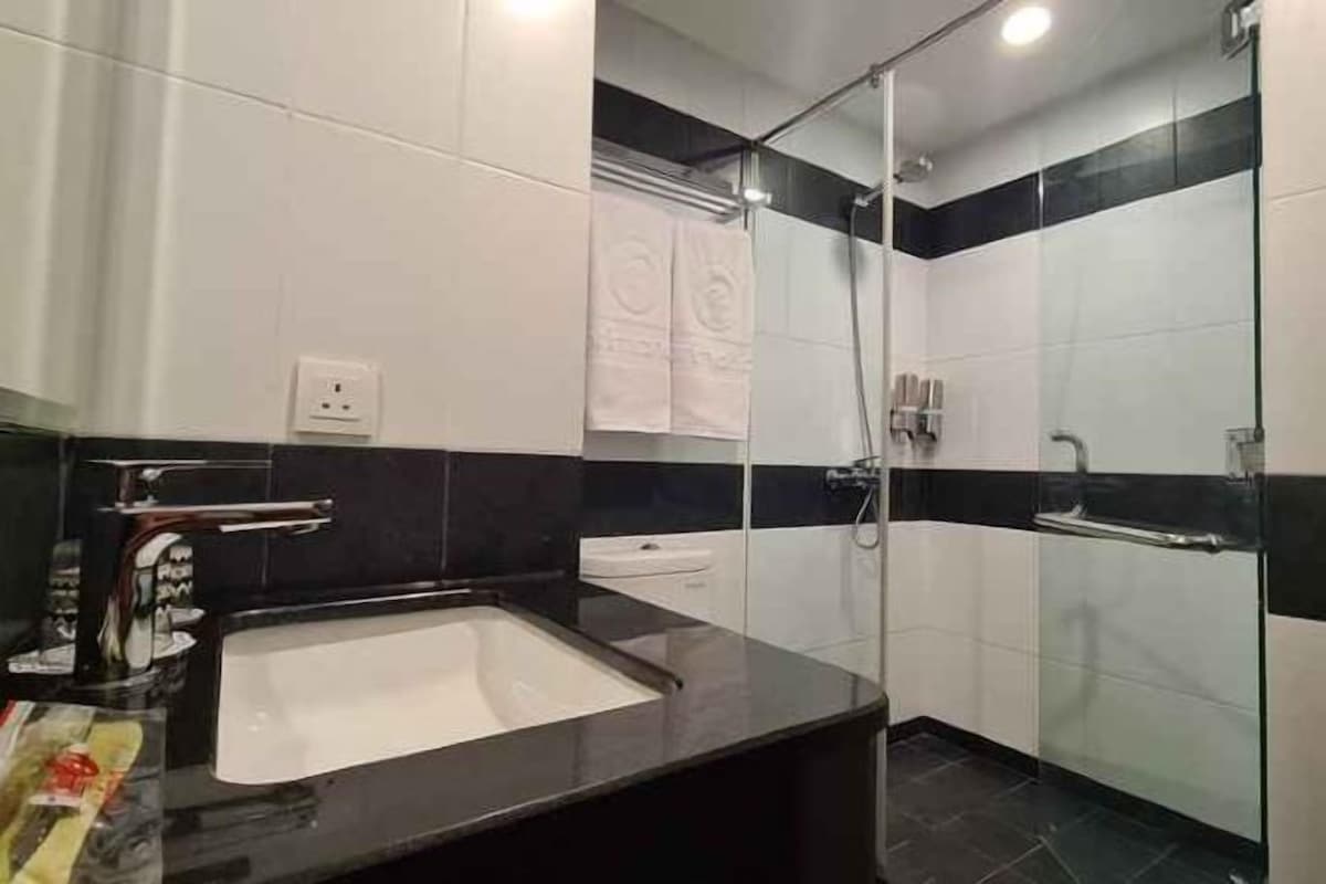 Bathroom | Shower, free toiletries, slippers, towels