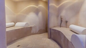 A modern bathroom with two sinks, a shower, and a towel rail.